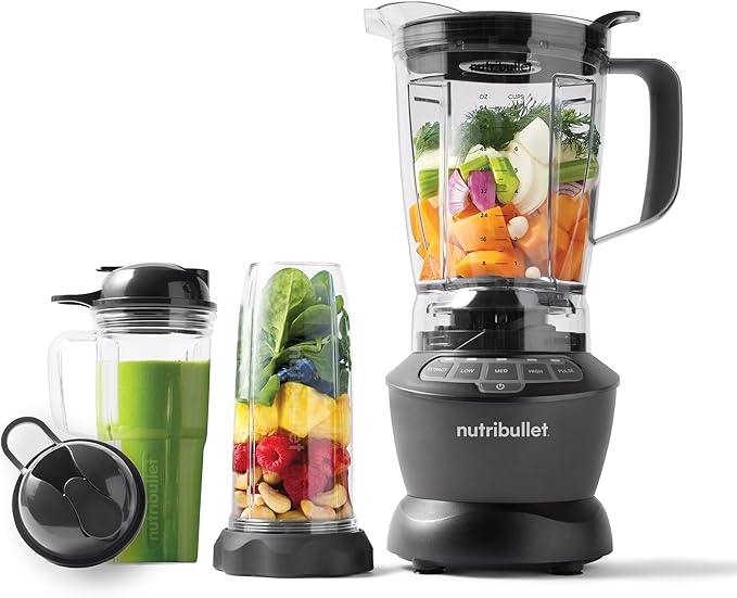 NutriBullet Full-Size Blender Combo with smoothie and vegetable ingredients in cups and pitcher, featuring a 1200W motor base and stainless steel blade system.